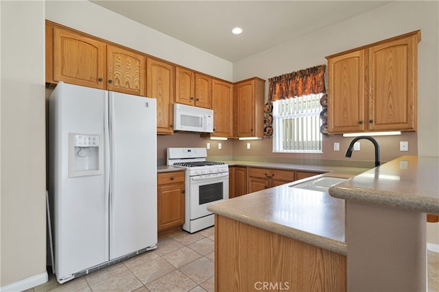 19269 Galloping Hill Rd, Apple Valley, CA 92308 - kitchen with white appliances, a sink, a peninsula, light tile patterned flooring, and brown cabinetry