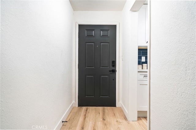 doorway featuring light hardwood / wood-style floors