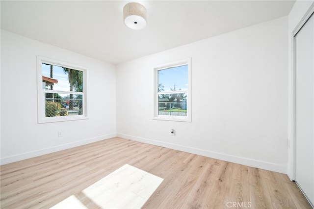 unfurnished room featuring light wood-type flooring