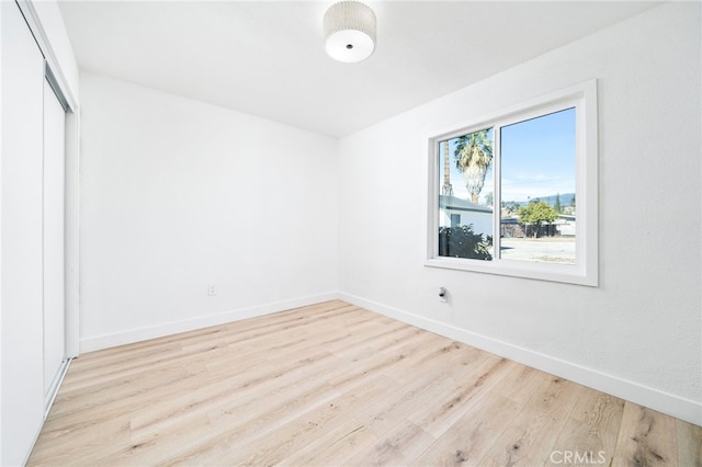 unfurnished room with light hardwood / wood-style floors