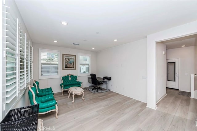 sitting room featuring light hardwood / wood-style floors