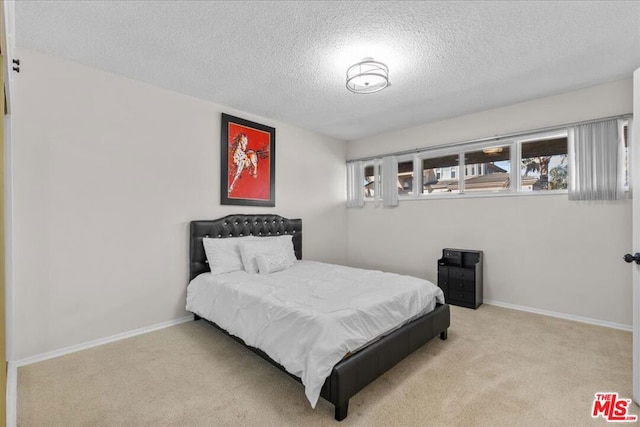 carpeted bedroom with a textured ceiling and billiards