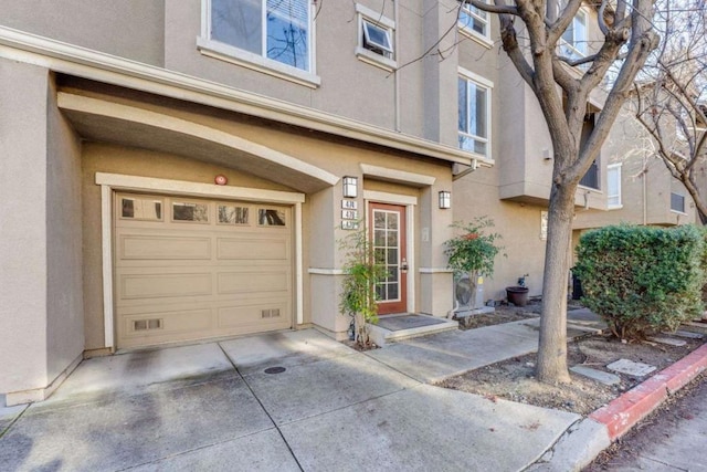 doorway to property featuring a garage