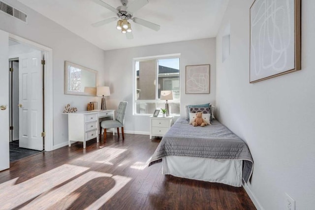 bedroom with ceiling fan and dark hardwood / wood-style floors