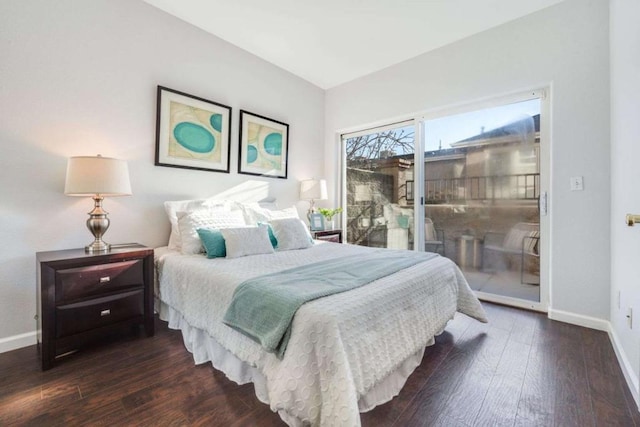 bedroom featuring access to exterior and dark hardwood / wood-style floors