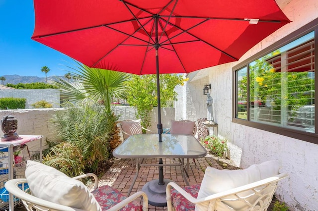 view of patio / terrace with a mountain view