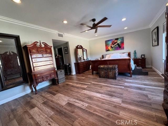 bedroom with crown molding, ceiling fan, and dark wood-type flooring