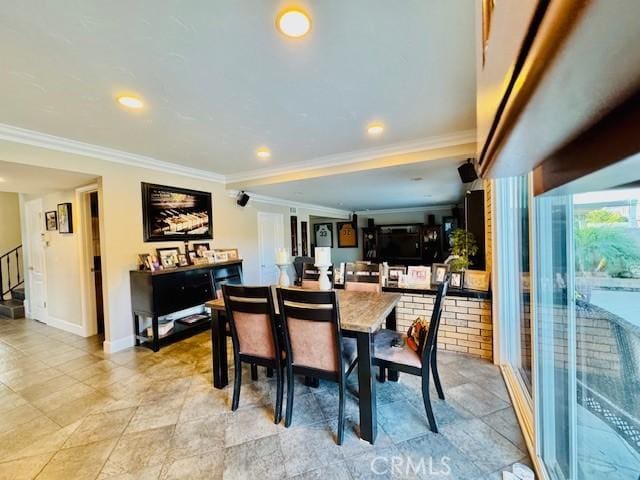 dining space with ornamental molding