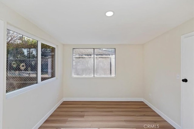 spare room featuring hardwood / wood-style flooring