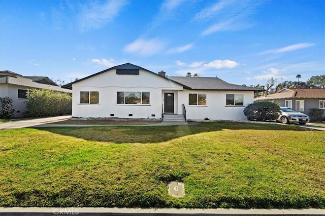 ranch-style house featuring a front lawn