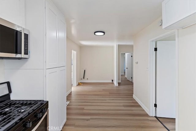 corridor featuring light hardwood / wood-style flooring