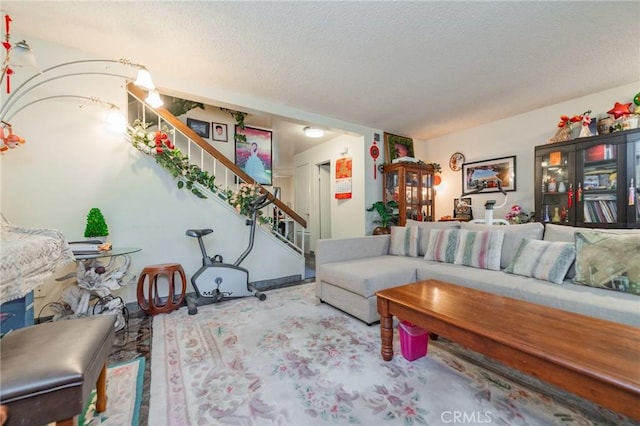 living room with a textured ceiling