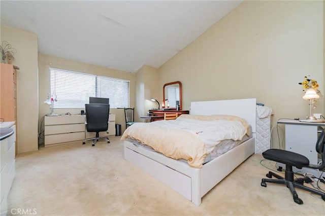 carpeted bedroom featuring lofted ceiling