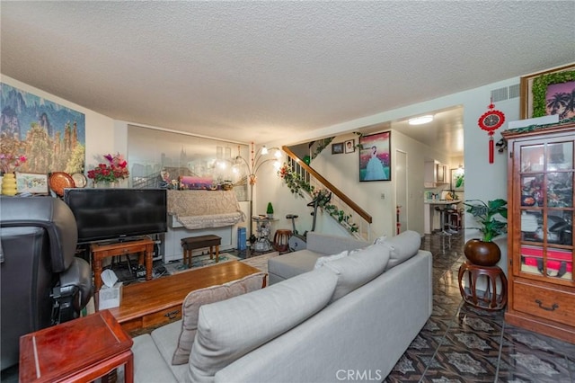 living room with a textured ceiling