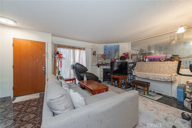 living room featuring a textured ceiling