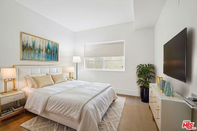 bedroom featuring light wood-type flooring