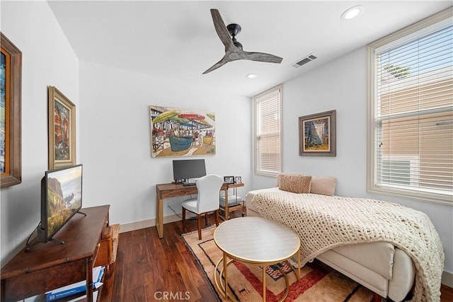 bedroom with ceiling fan and dark hardwood / wood-style floors