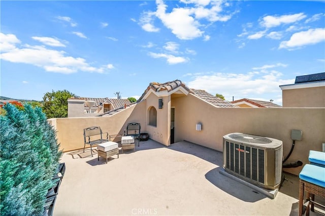 back of property featuring a patio area and central air condition unit