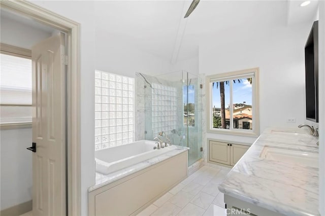 bathroom featuring tile patterned floors, vanity, and separate shower and tub