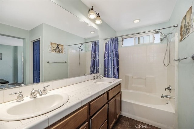 bathroom with vanity and shower / bath combo with shower curtain