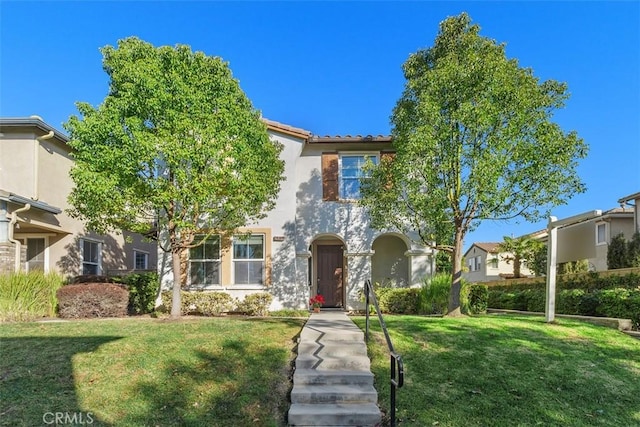 view of front facade featuring a front yard