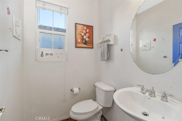 bathroom with toilet and sink