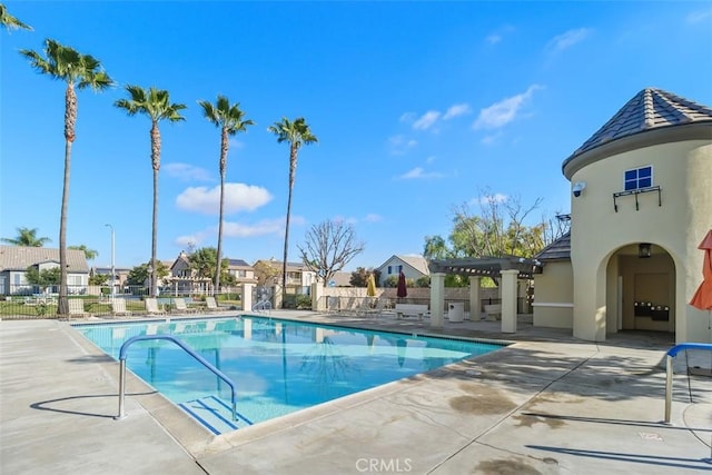 view of swimming pool featuring a pergola and a patio