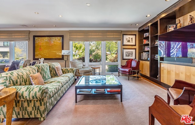 living room featuring crown molding and carpet flooring