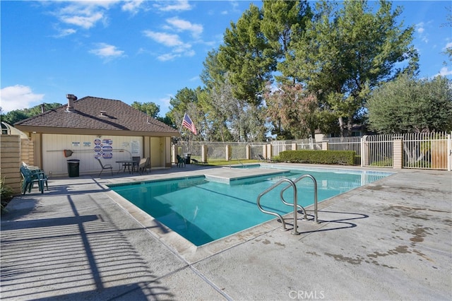 view of swimming pool with a patio area