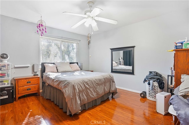 bedroom featuring ceiling fan and hardwood / wood-style floors