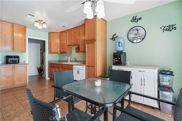 kitchen with ceiling fan, light tile patterned floors, dishwasher, and sink