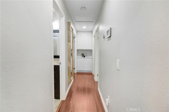 hallway featuring light hardwood / wood-style flooring