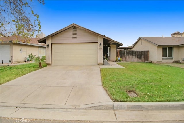 single story home with a front yard and a garage