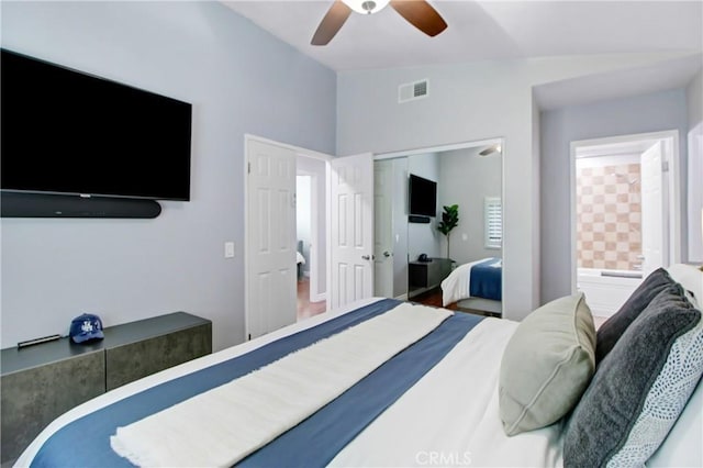 bedroom with vaulted ceiling, ceiling fan, and a closet