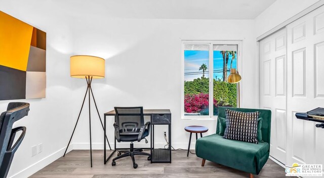 home office featuring a wealth of natural light and hardwood / wood-style floors