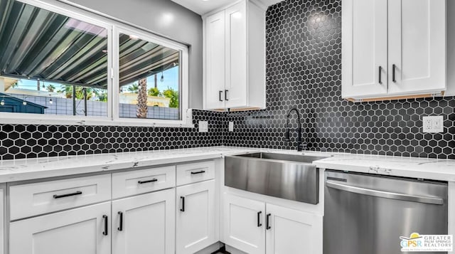 kitchen featuring sink, white cabinetry, and dishwasher