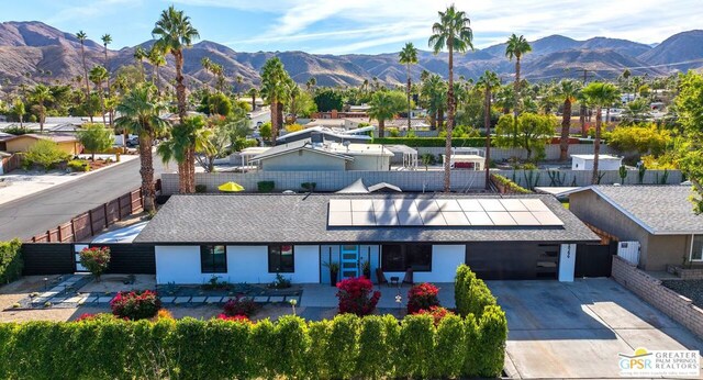 birds eye view of property with a mountain view