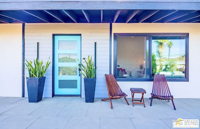 property entrance with a patio