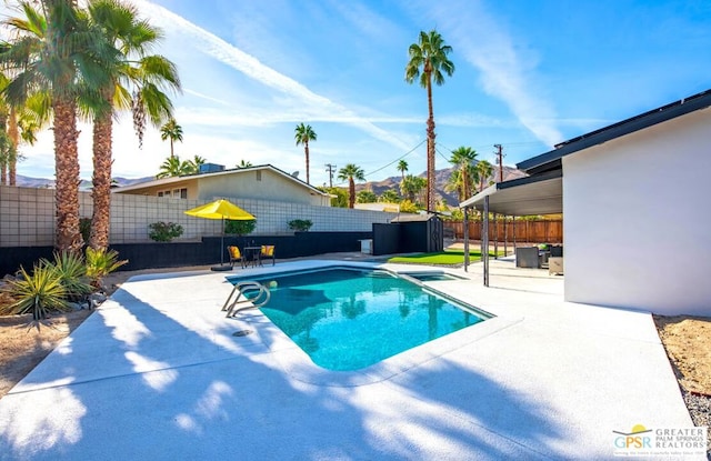 view of pool featuring a patio area