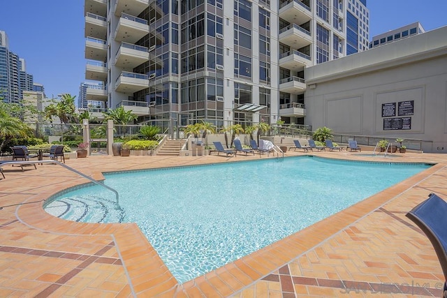 view of pool featuring a patio