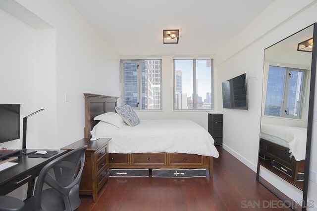 bedroom featuring dark hardwood / wood-style flooring