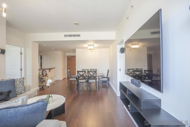 living room with dark hardwood / wood-style floors