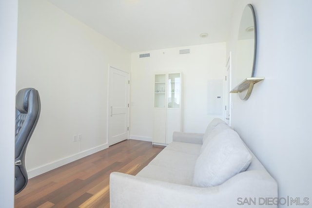 living room featuring dark wood-type flooring