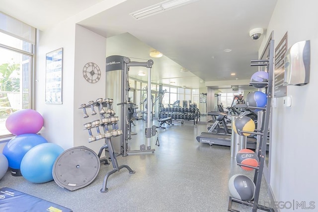 gym with floor to ceiling windows