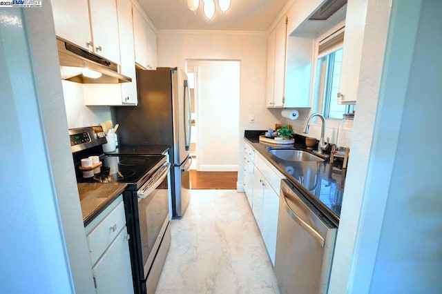 kitchen with appliances with stainless steel finishes, dark stone counters, crown molding, white cabinets, and sink