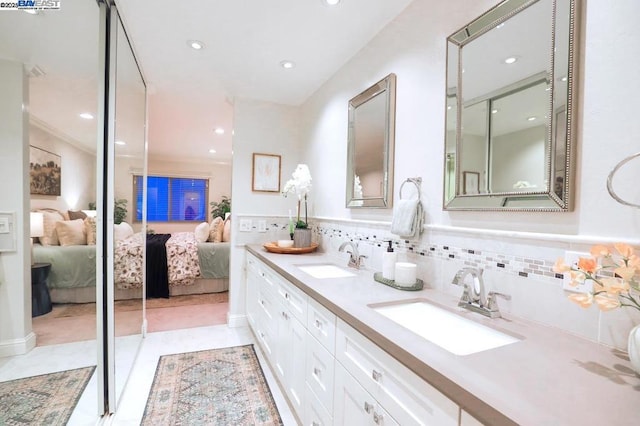 bathroom with vanity and tile patterned flooring