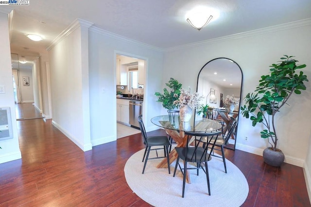 dining room featuring dark hardwood / wood-style floors and crown molding