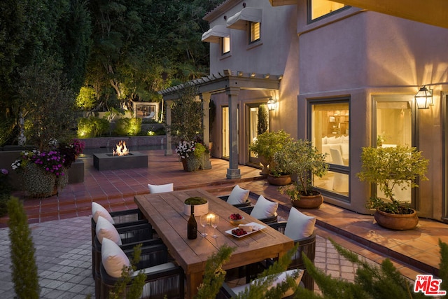 view of patio featuring an outdoor fire pit