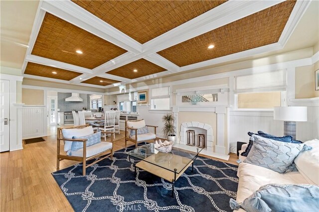 living room featuring wood ceiling, wood-type flooring, beamed ceiling, crown molding, and coffered ceiling