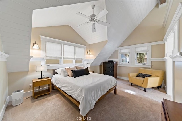 bedroom with vaulted ceiling, ceiling fan, and light colored carpet